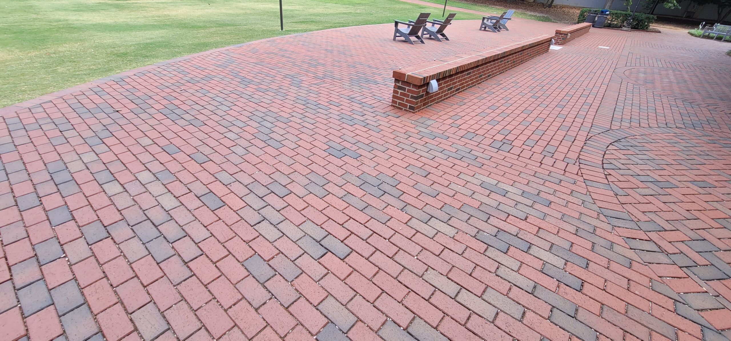 Permeable paver system allowing stormwater to infiltrate through the surface, mitigate flooding, and reduce runoff at a College in North Carolina