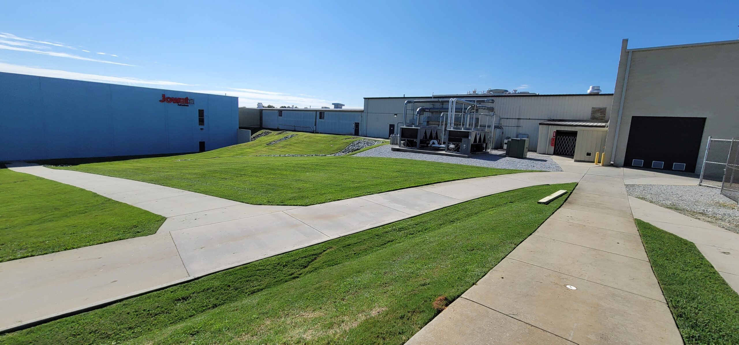 Certified SWPPP inspector conducting stormwater compliance inspection with erosion and sediment control measures on active construction site