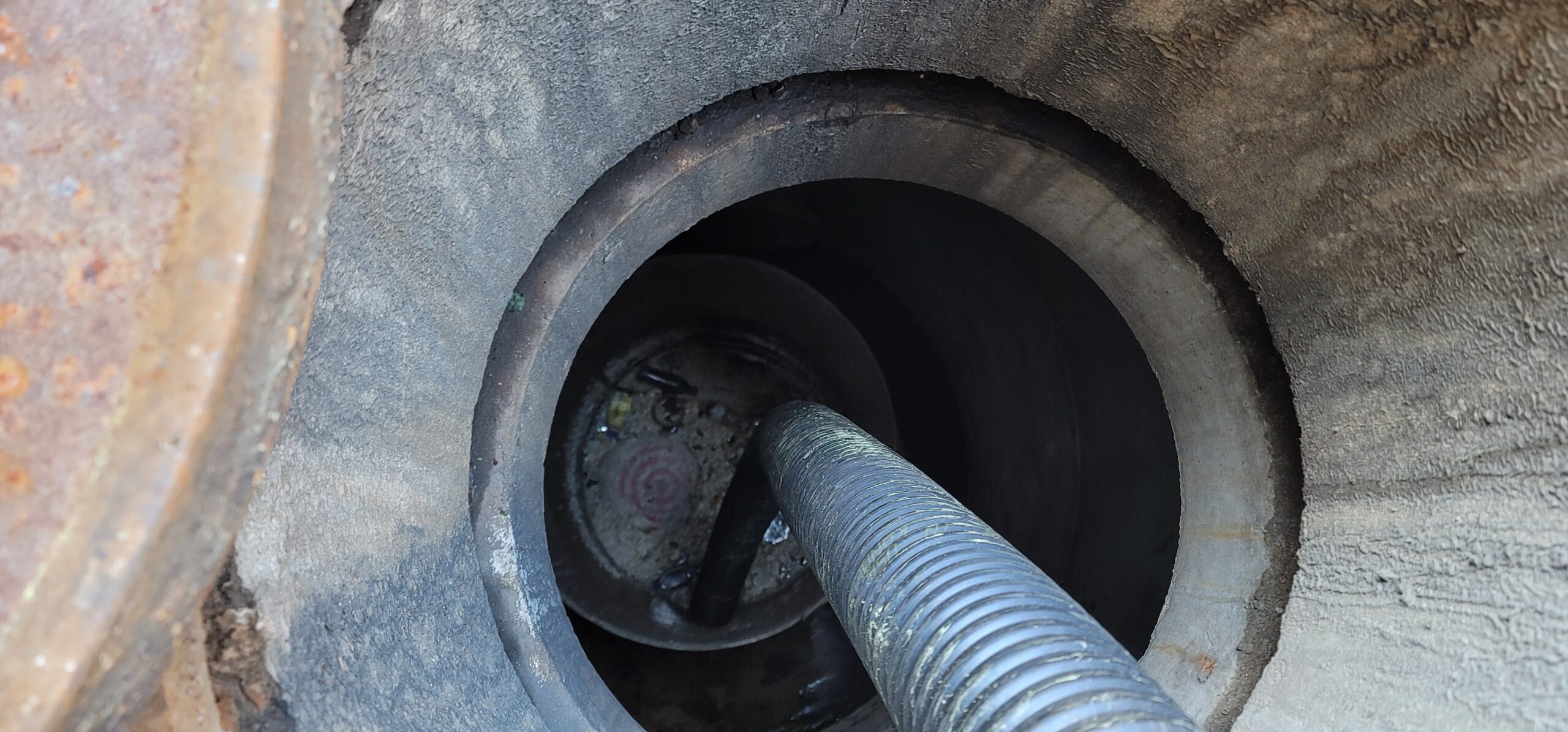 Vactor truck cleaning storm drain system