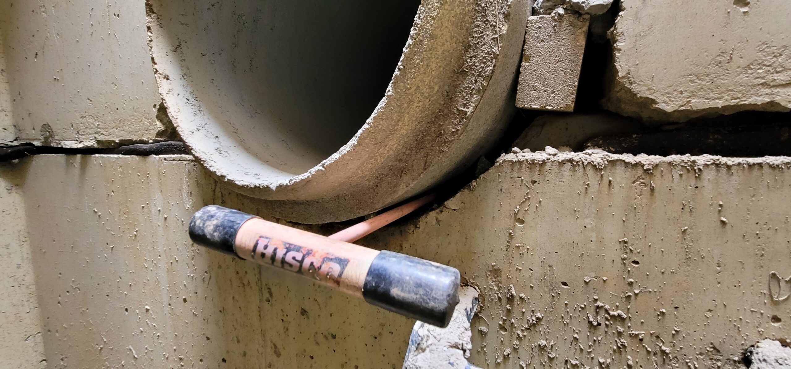 Stormwater structural repair of damaged concrete catch basin and deteriorated storm drain pipe.