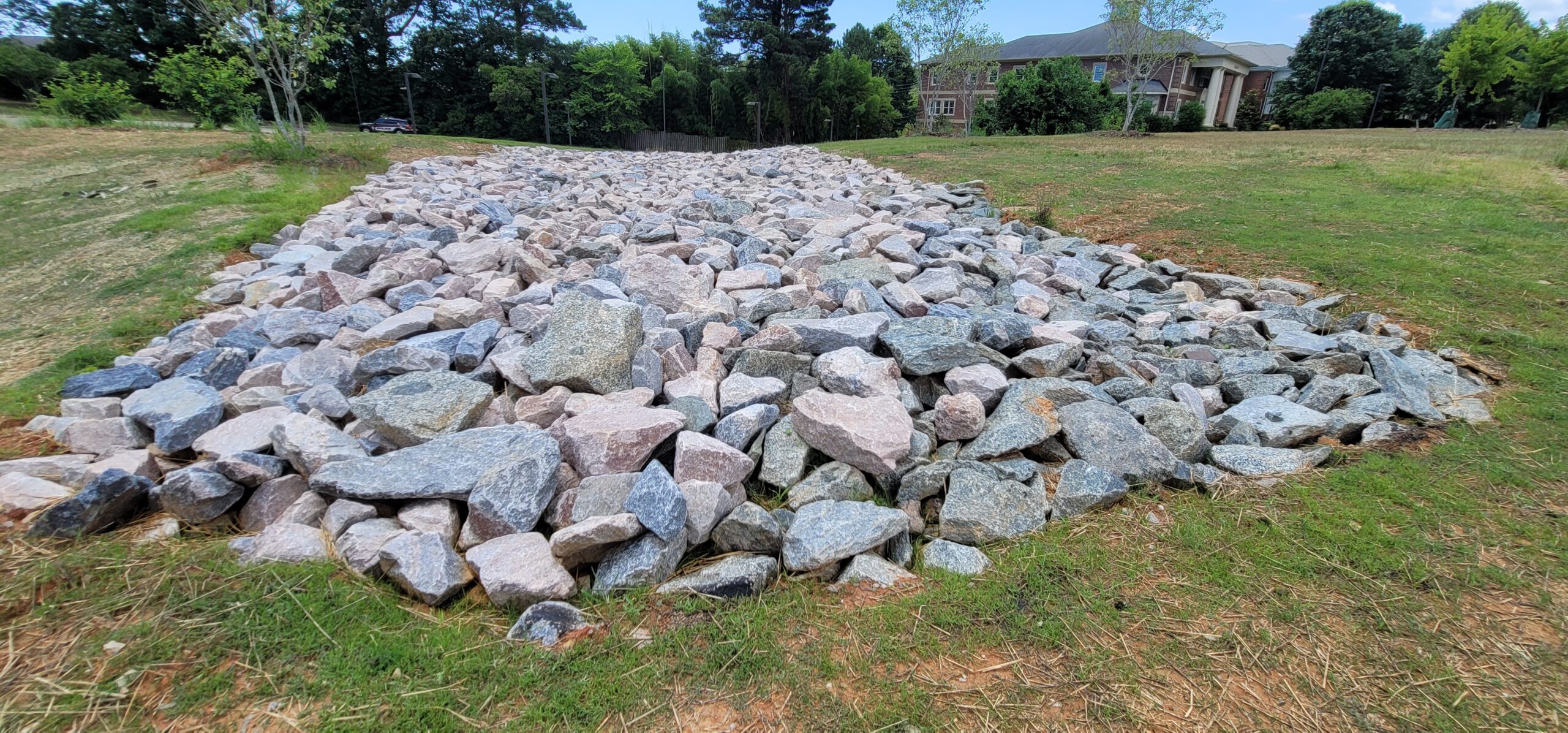 Grassed and rip rap swale conveying stormwater runoff