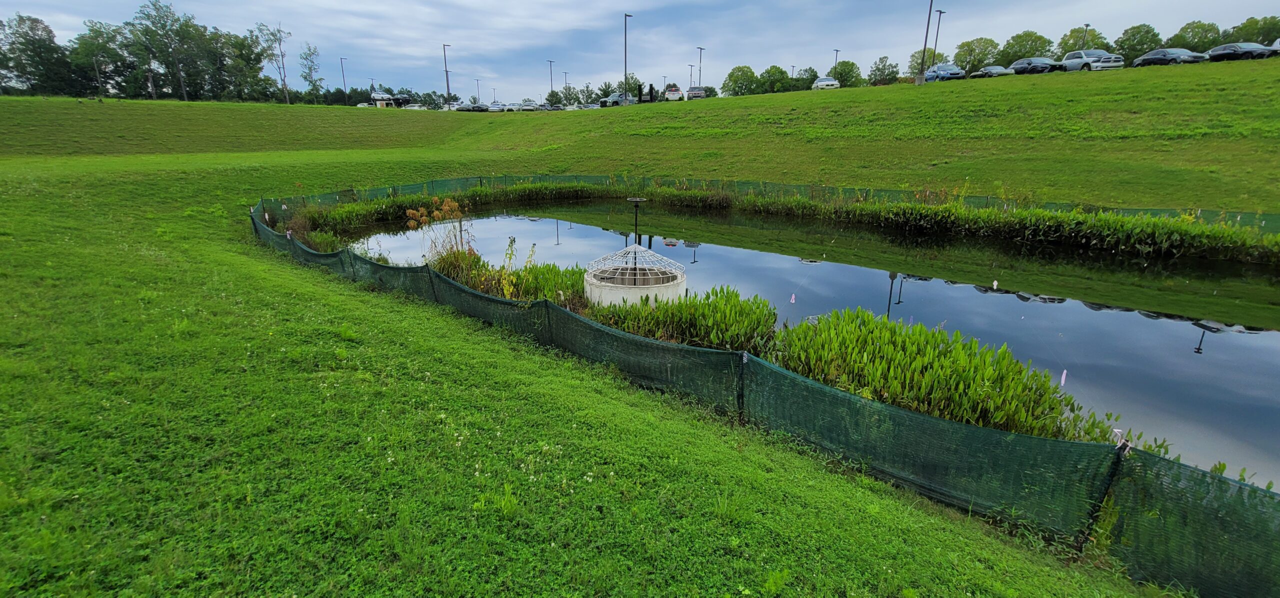 Construction crew installing new stormwater control measure and underground drainage infrastructure