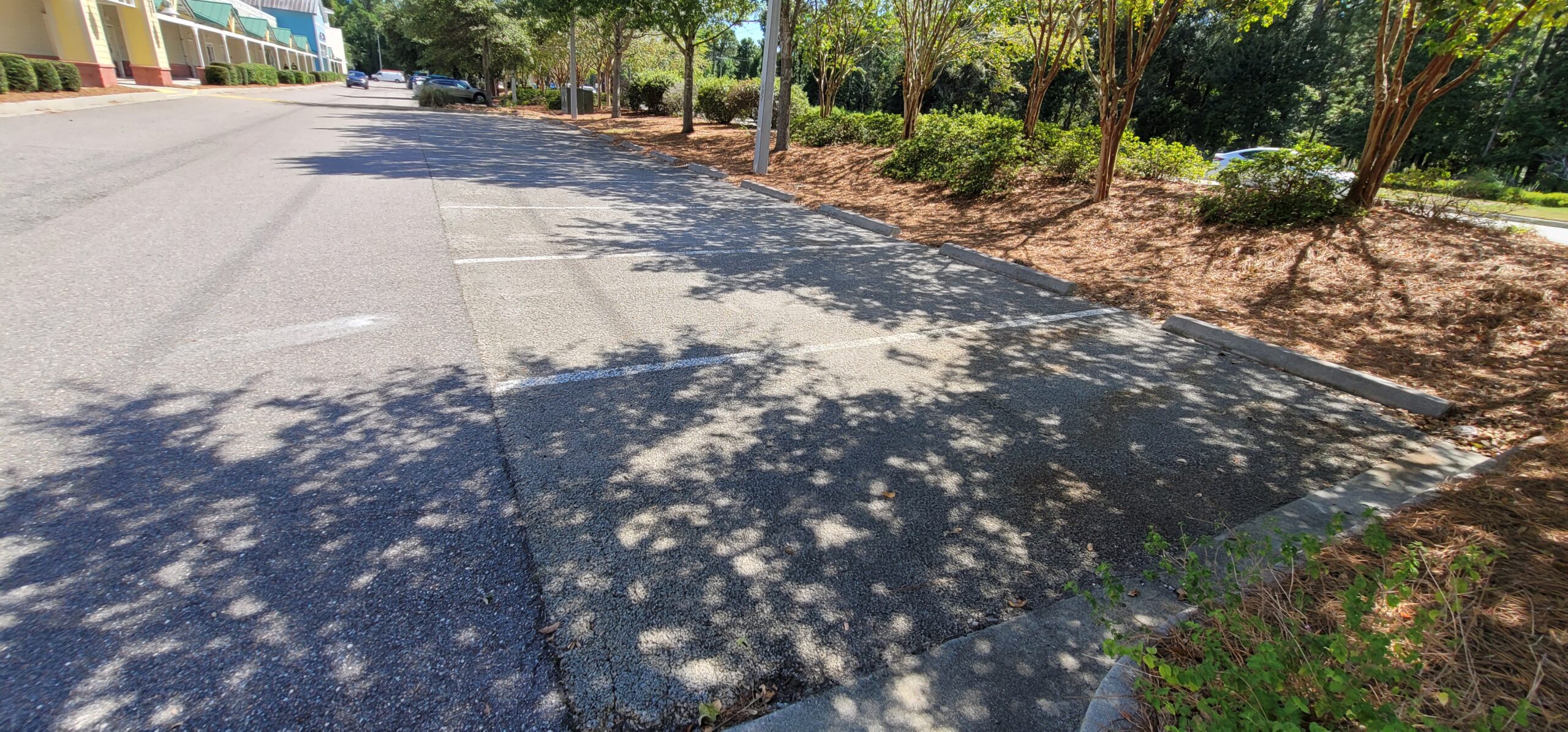 Permeable pavement system allowing stormwater infiltration into an underlying stone reservoir at a commercial site