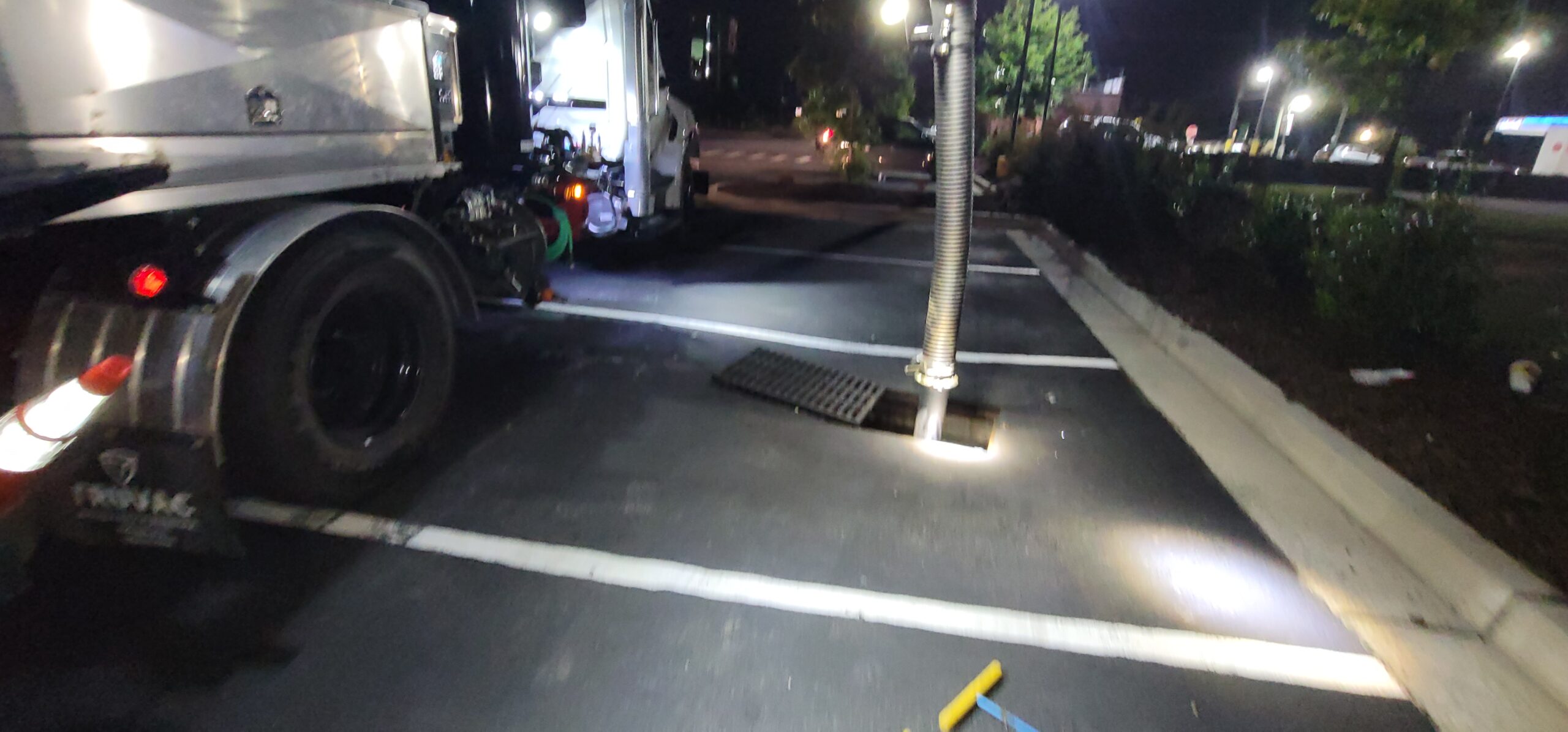 Vactor truck performing stormwater catch basin cleaning to remove sediment and debris.