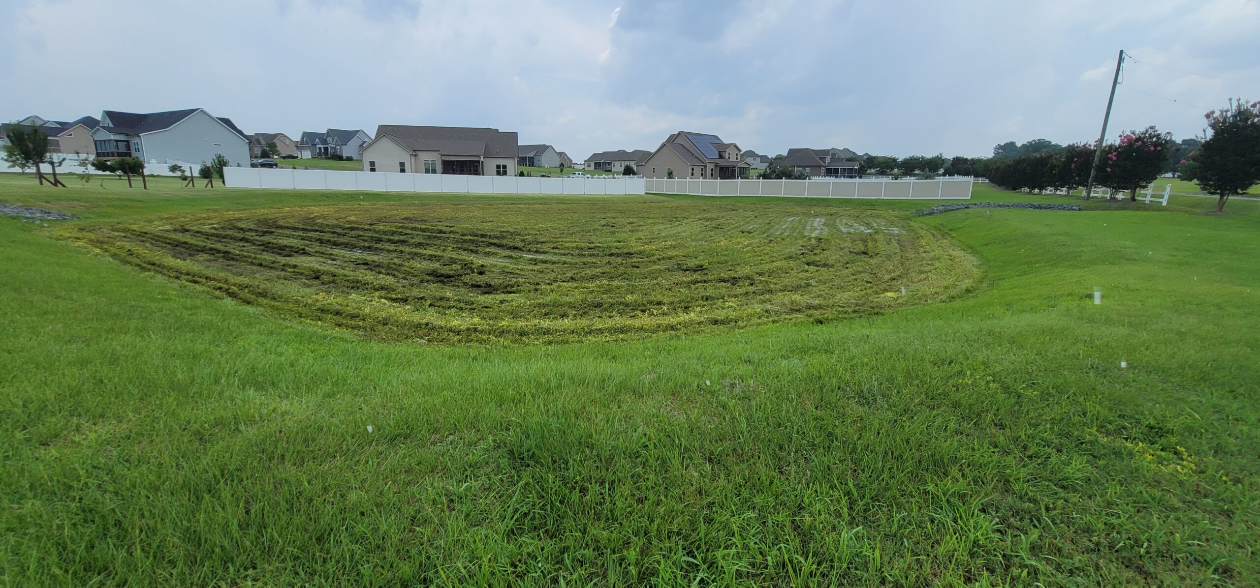 Stormwater retention basin temporarily storing runoff to reduce peak flow and allow sedimentation in North Carolina